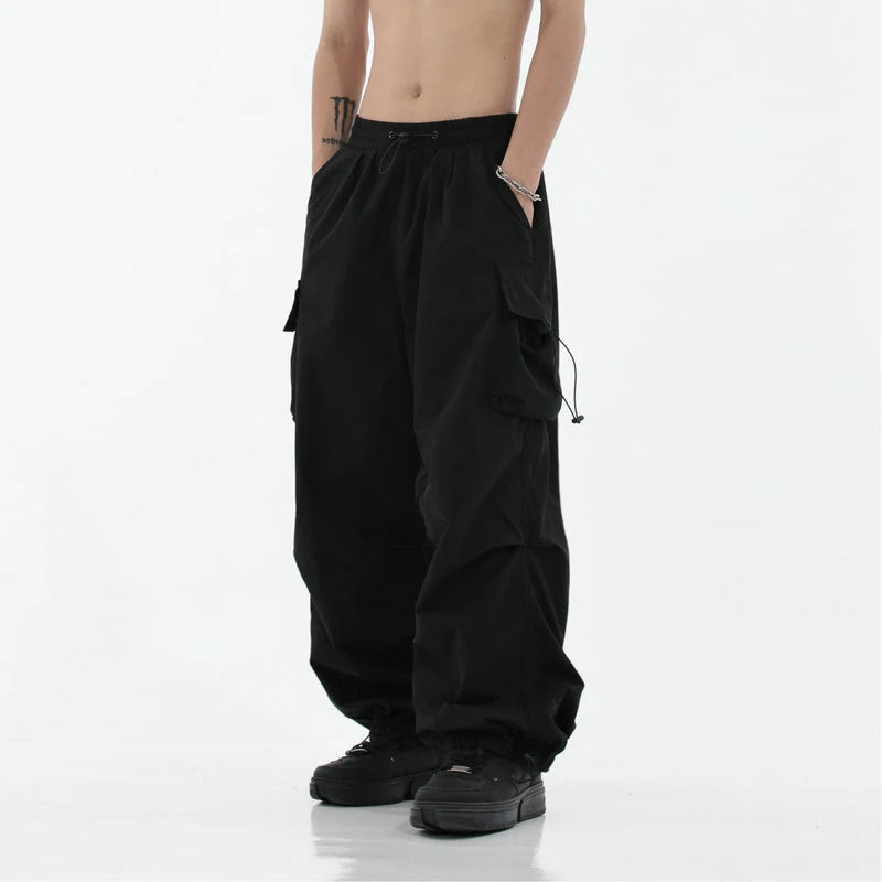 Calça masculina casual de primavera/verão - Streetwear, estilo Harajuku, pernas largas, elástico na cintura, cor sólida, calça cargo para homem.