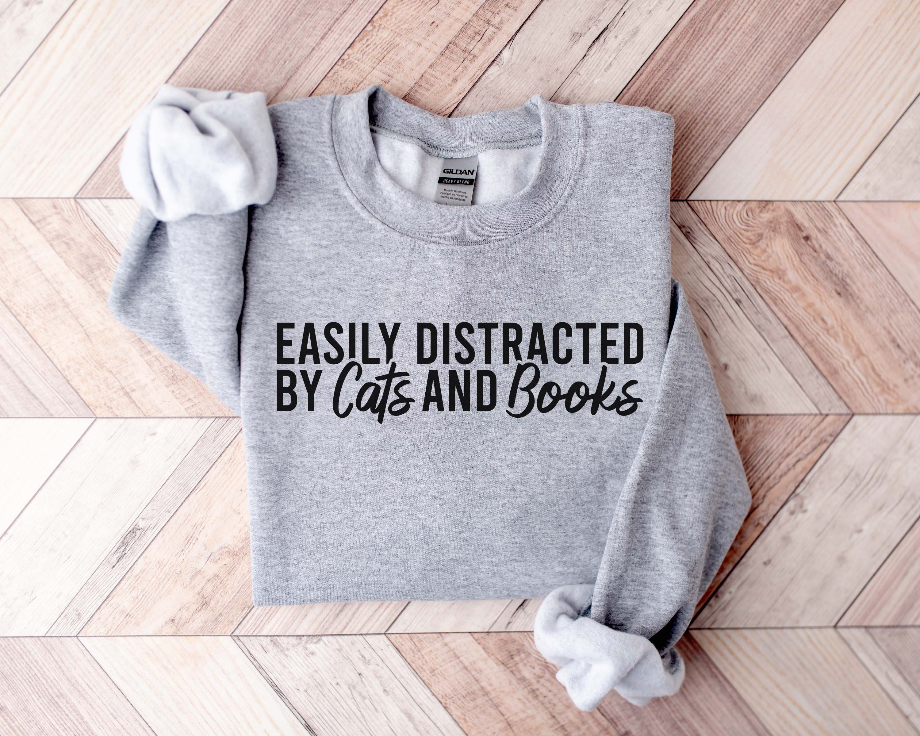 Easily Distracted By Cats And Books Sweatshirt