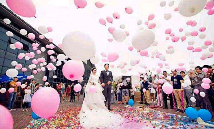 Ground explode flying color balloons for wedding couple entry ceremony grand groom bride event party show